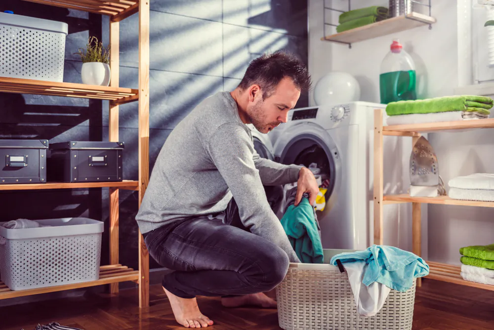 Clean your washing machine frequently to prevent it from accumulating mildew or smells. (Zivica Kerkez/Shutterstock)