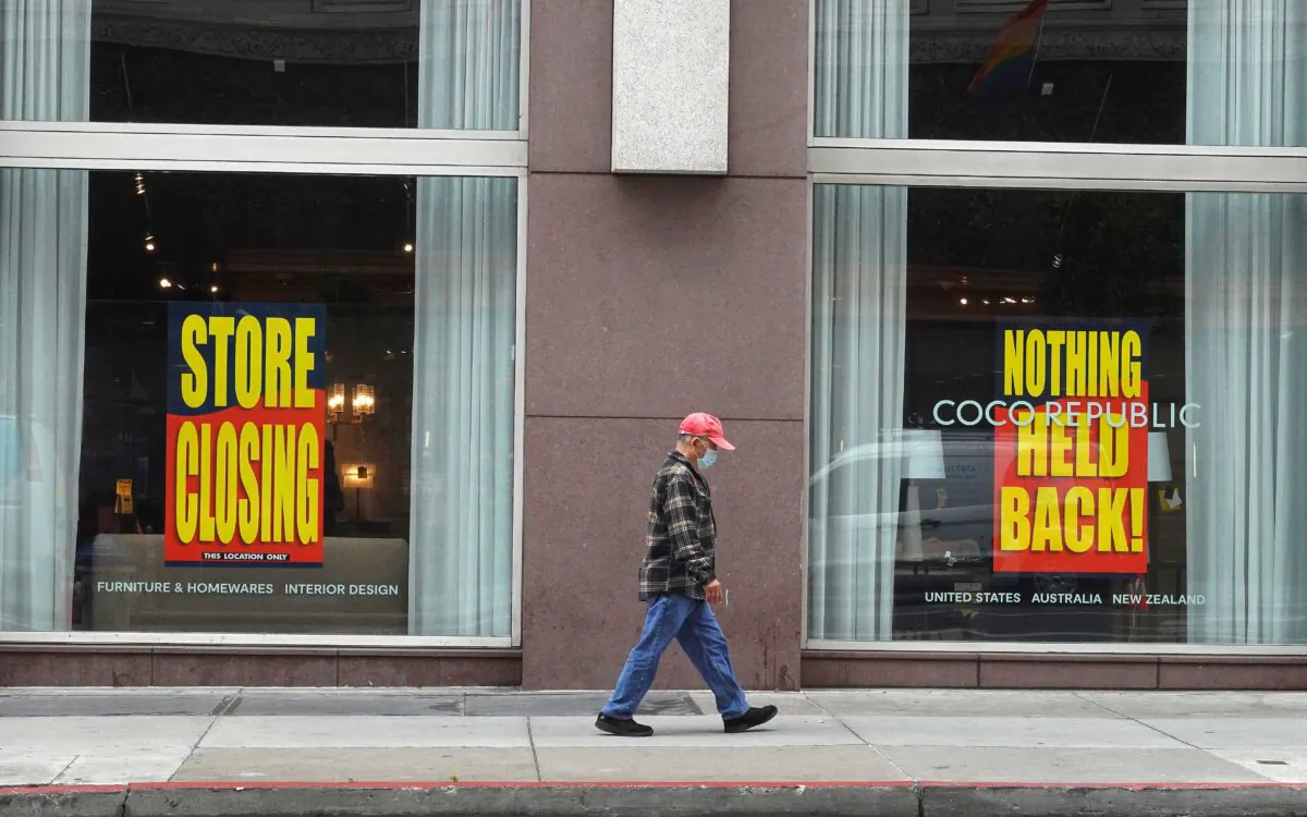 A pedestrian walks by a store that is closing in San Francisco, Calif., on June 14, 2023. (Justin Sullivan/Getty Images