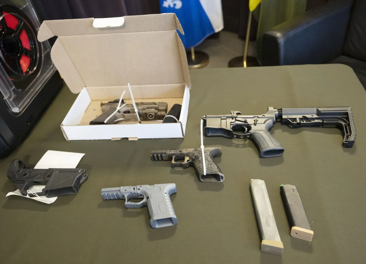 Some of the 3D-printed ghost guns seized in Operation Centaure are displayed during a news conference in Montreal, June 21, 2023. (The Canadian Press/Ryan Remiorz)