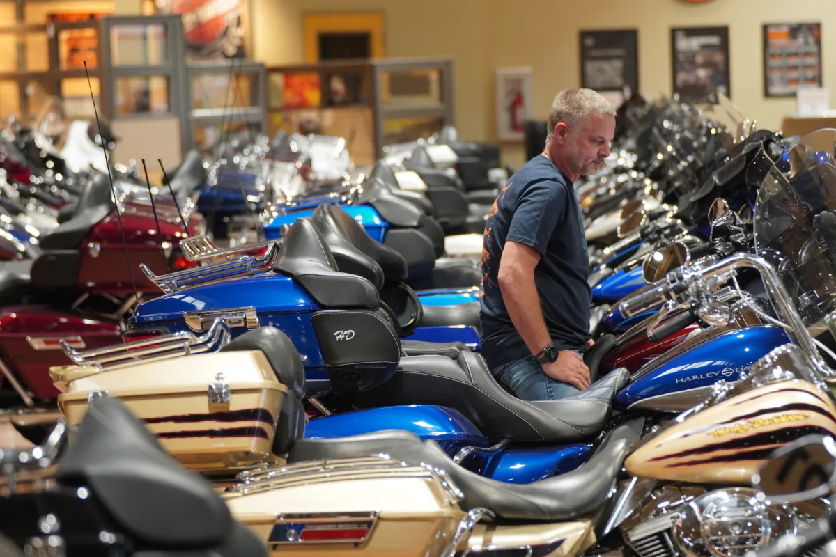 A customer ponders making a potential purchase at Black Hills Harley-Davidson in Rapid City, South Dakota, on June 17, 2023. (Allan Stein/The Epoch Times)