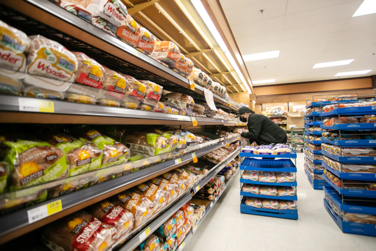 A worker restocks shelves in the bakery and bread aisle at an Atlantic Superstore grocery in Halifax on Jan. 28, 2022. (The Canadian Press/Kelly Clark)