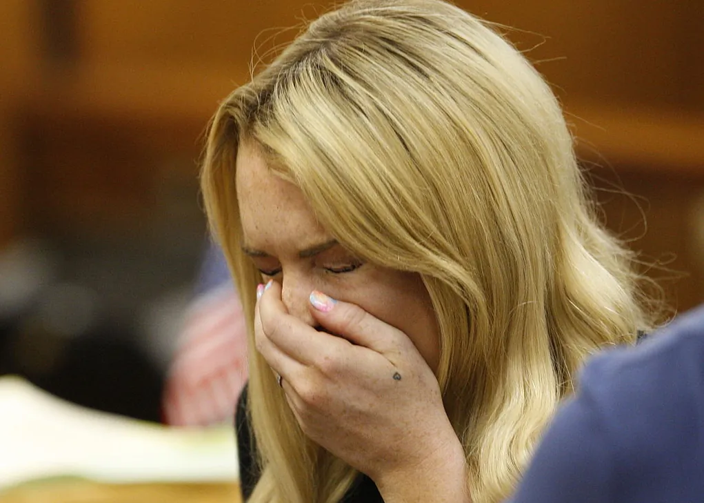 Lindsay Lohan sneezes during her hearing at the Beverly Hills Courthouse, Calif., on July 6, 2010. (David Mcnew/AFP via Getty Images)