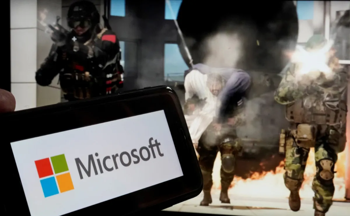 The logo for Microsoft, and a scene from Activision "Call of Duty—Modern Warfare," in New York, on June 21, 2023. (AP Photo/Richard Drew)
