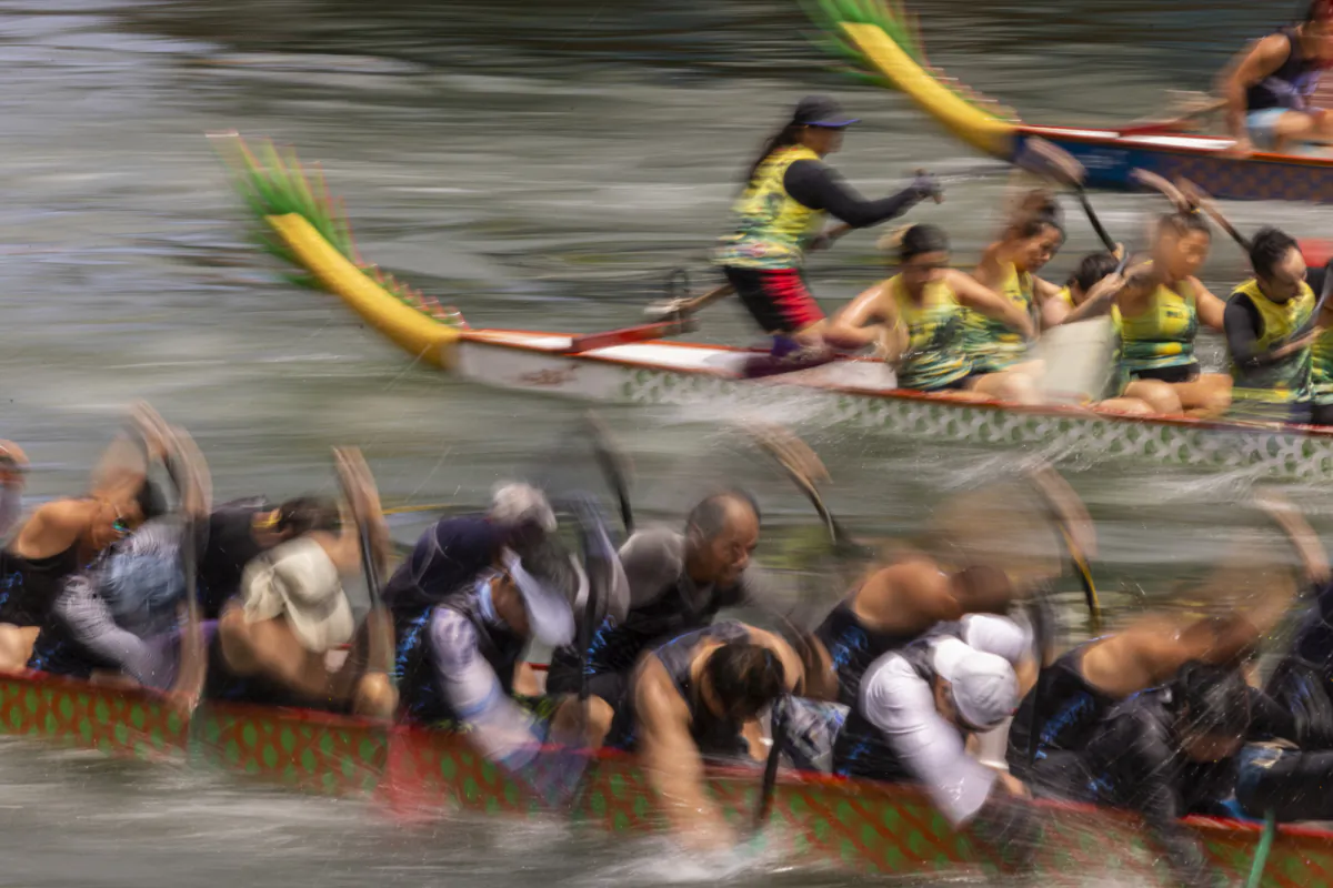 Competitors take part in the annual dragon boat race to celebrate the Dragon Boat festival in Hong Kong on June 22, 2023. (Louise Delmotte/AP Photo)