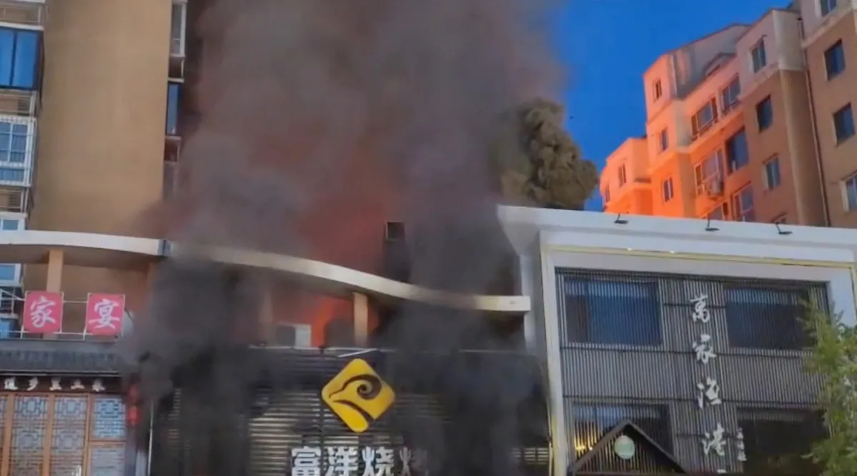 Smoke rises from a building following a gas explosion at a barbecue restaurant in Yinchuan, Ningxia, China, on June 21, 2023. (Video obtained by Reuters/Handout via Reuters)
