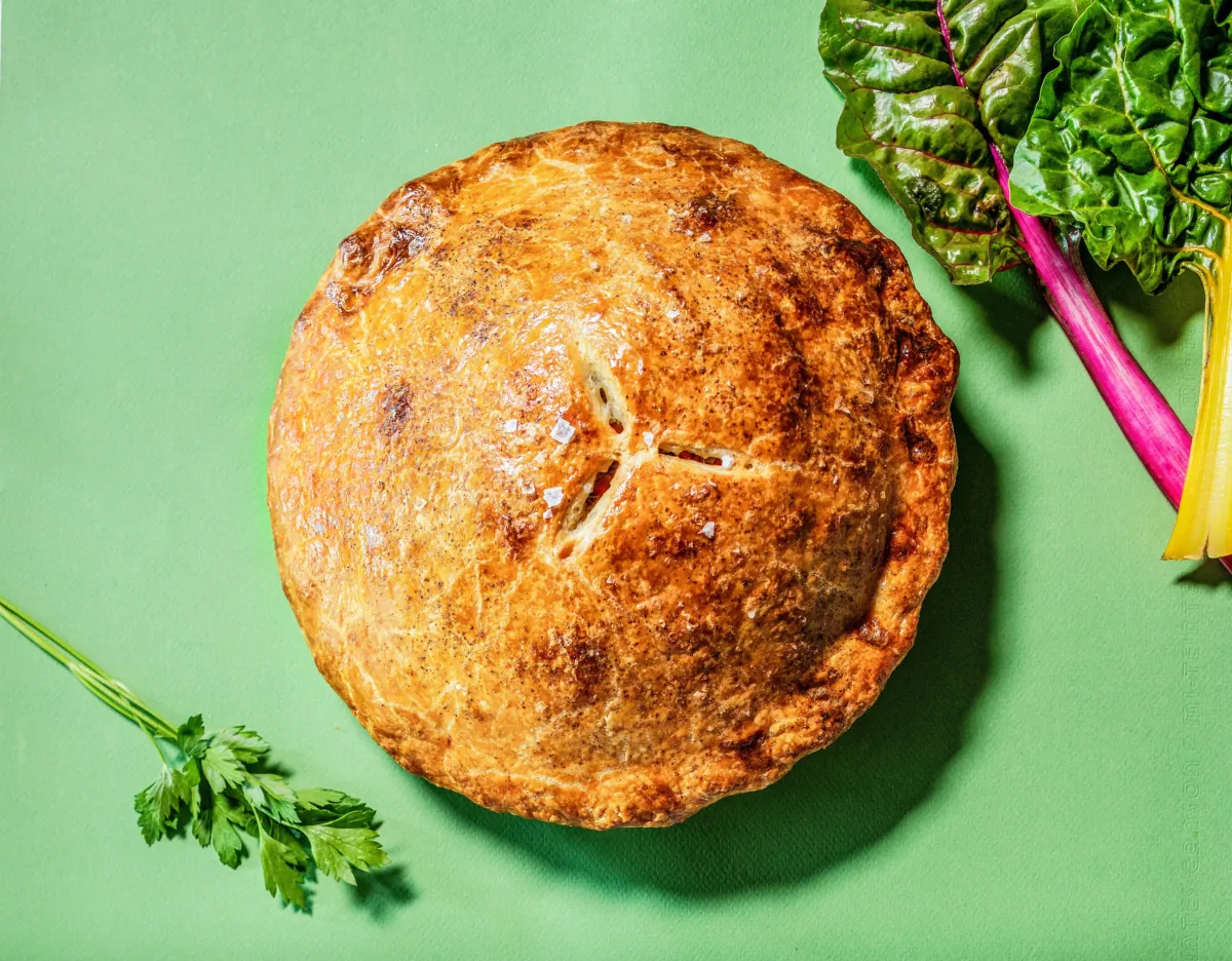 Chicken pot pie that brightens your day—filled with bright vegetables and herbs.(Ricardo DeAratanha/Los Angeles Times; prop stylist Nia Allen Lee/For The Times/TNS)