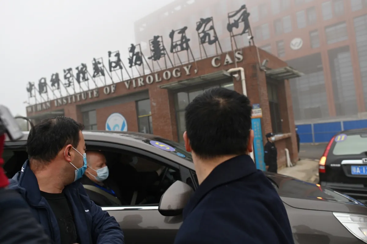 Members of the World Health Organization (WHO) team investigating the origins of the COVID-19 coronavirus arrive by car at the Wuhan Institute of Virology in Wuhan in China's central Hubei province on Feb. 3, 2021. (Hector Retamal/AFP via Getty Images)