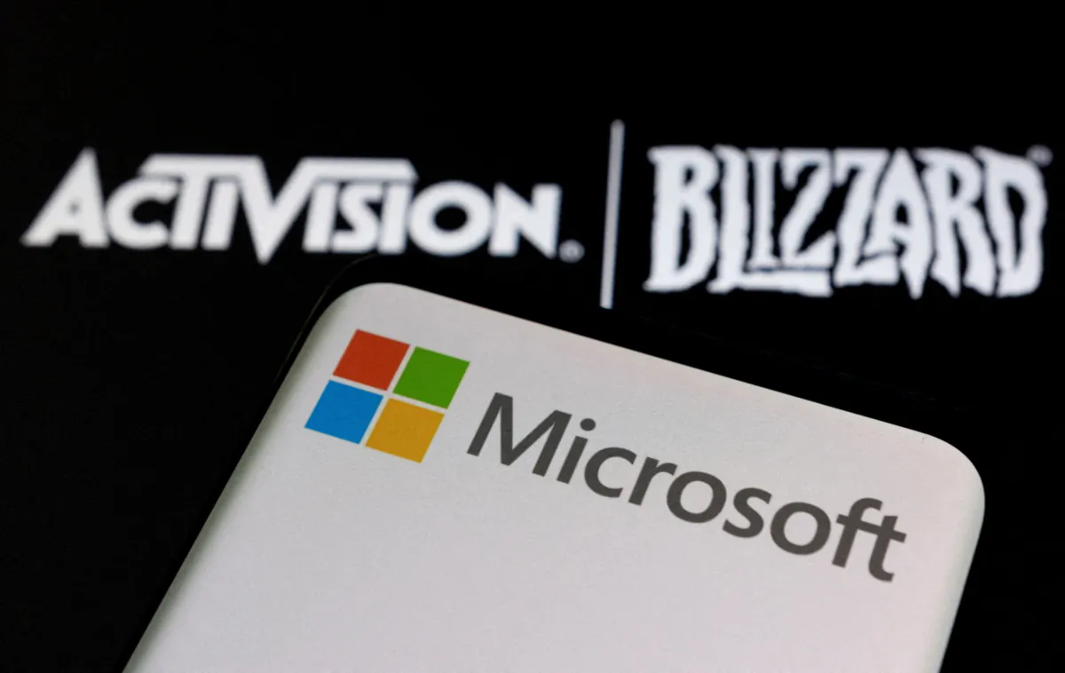 A Microsoft logo on a smartphone placed on a displayed Activision Blizzard logo in this illustration taken on Jan. 18, 2022. (Dado Ruvic/Illustration/Reuters)