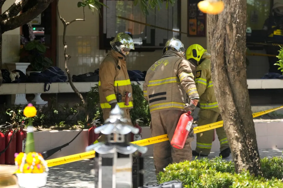 Firefighters investigate an explosion site at a school in Bangkok, Thailand, on June 23, 2023. (Sakchai Lalit/AP Photo)