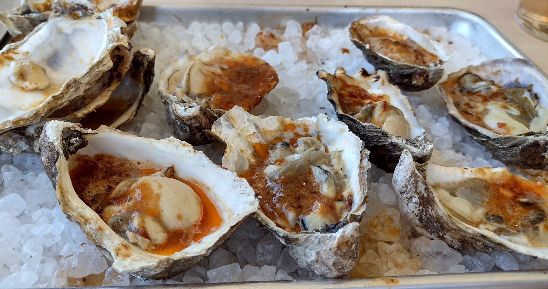 Grilled oysters in spicy chili butter