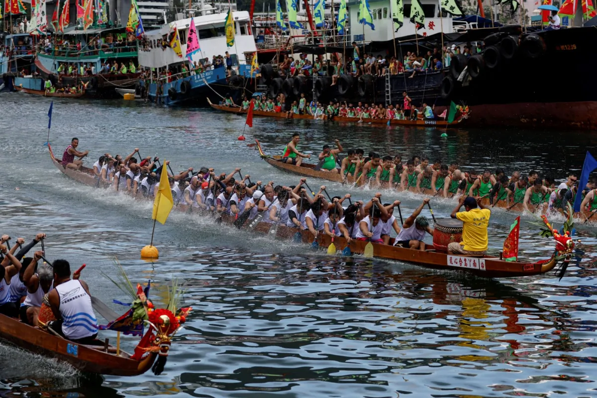 Dragon boats compete during the annual Tuen Ng or Dragon Boat Festival at Aberdeen fishing port in Hong Kong on June 22, 2023. (Tyrone Siu/Reuters)