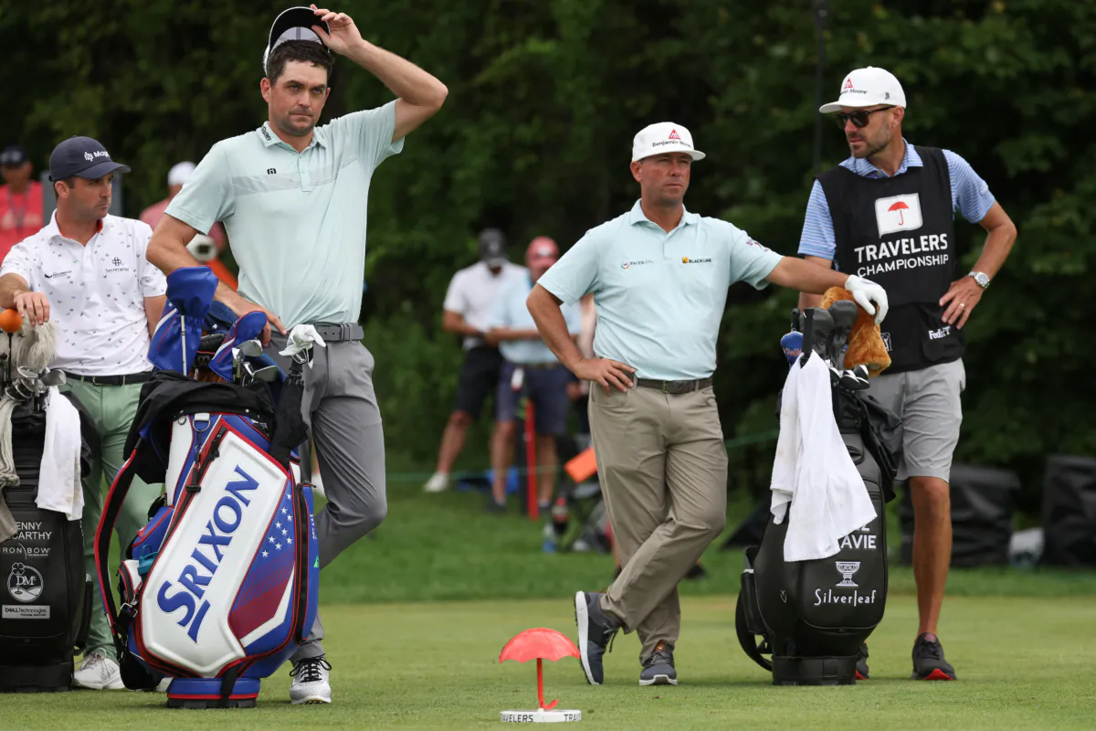 Denny McCarthy (L-R) of the United States, Keegan Bradley of the United States and Chez Reavie of the United States wait on the 13th tee during the third round of the Travelers Championship at TPC River Highlands in Cromwell, Conn., on June 24, 2023. (Patrick Smith/Getty Images)