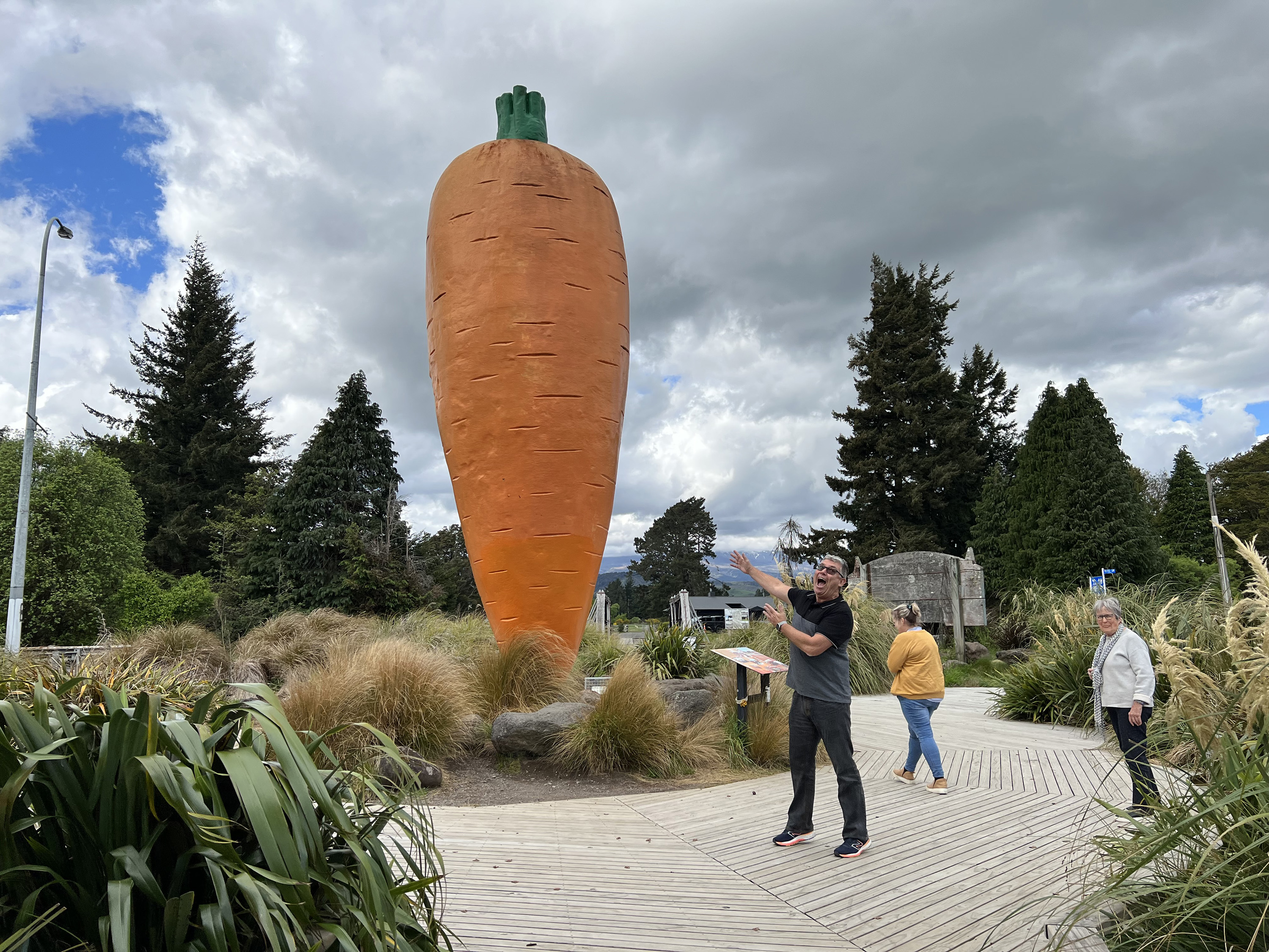 Mark Hockley of Great Journeys shows off a massive carrot sculpture, the centerpiece of Ohakune Carrot Adventure Park in Okahune.