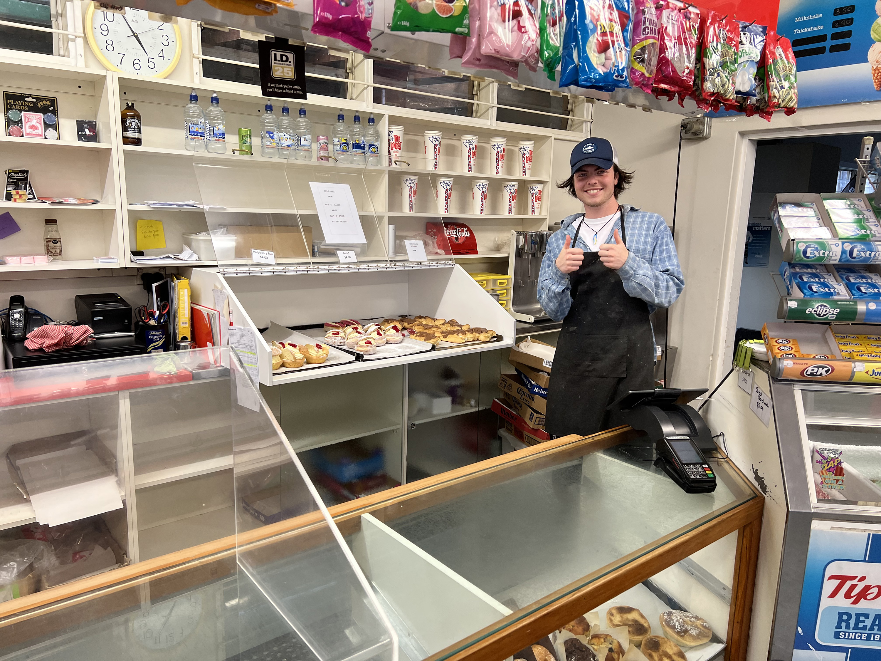 Jack Wells shows off freshly baked pastries at the Chocolate Éclair Shop