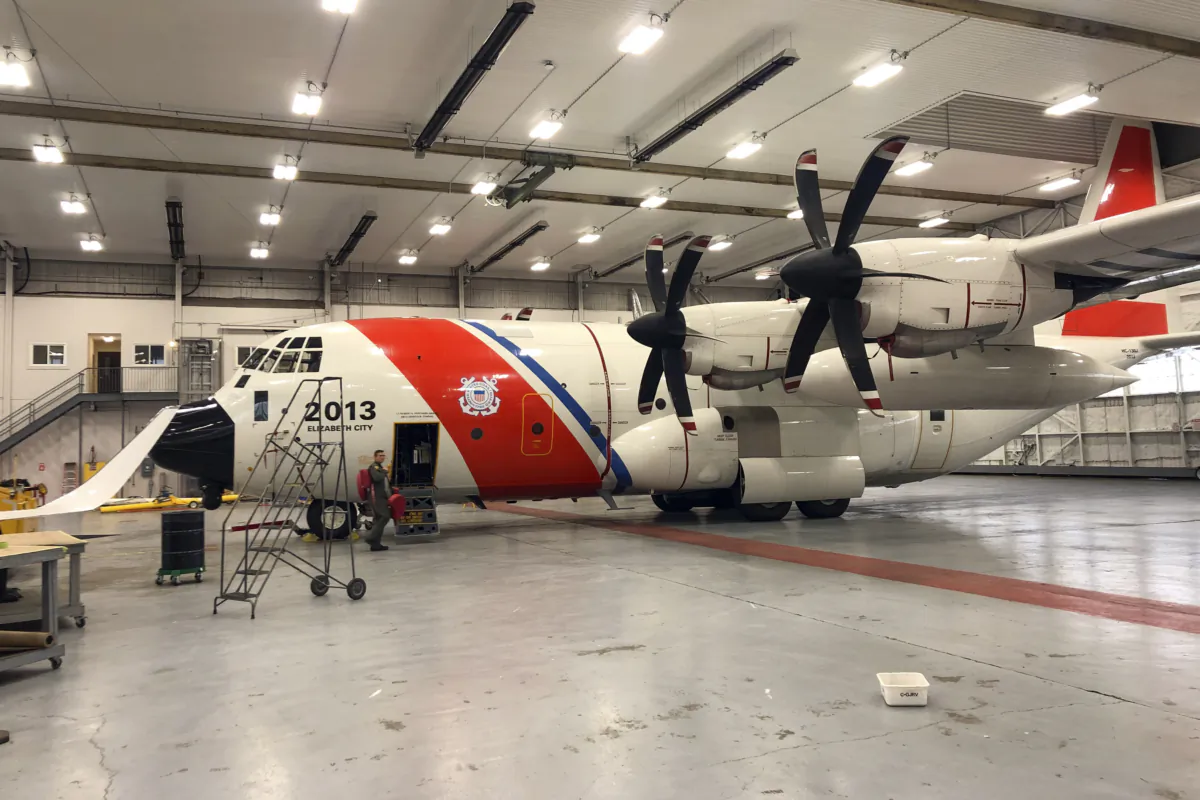 Crew members prepare to depart on a Coast Guard HC-130 Hercules airplane to help in the search for the Titan submersible in St. John's, Newfoundland, Canada on June 21, 2023. (Petty Officer 1st Class Amber Howie/U.S. Coast Guard via AP)