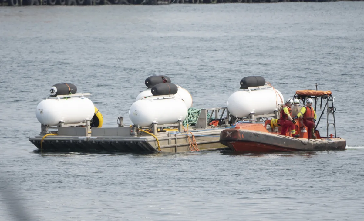 The Titan launch barge is moved to the Coast Guard yard at port in St. John's, Newfoundland, Canada, on June 24, 2023. (Adrian Wyld/The Canadian Press via AP)
