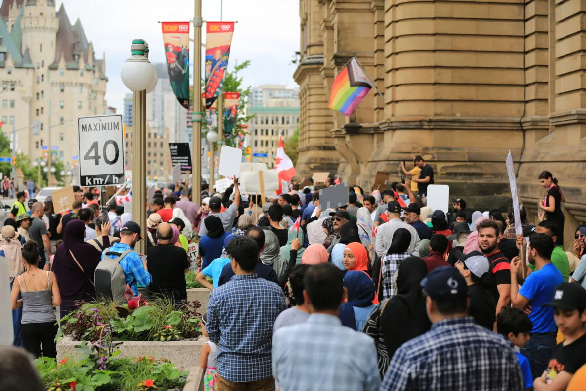 A large crowd of protesters gather outside Prime Minister Justin Trudeau's office to protest gender ideology in schools, in Ottawa on June 24, 2023. (Jonathan Ren/The Epoch Times)