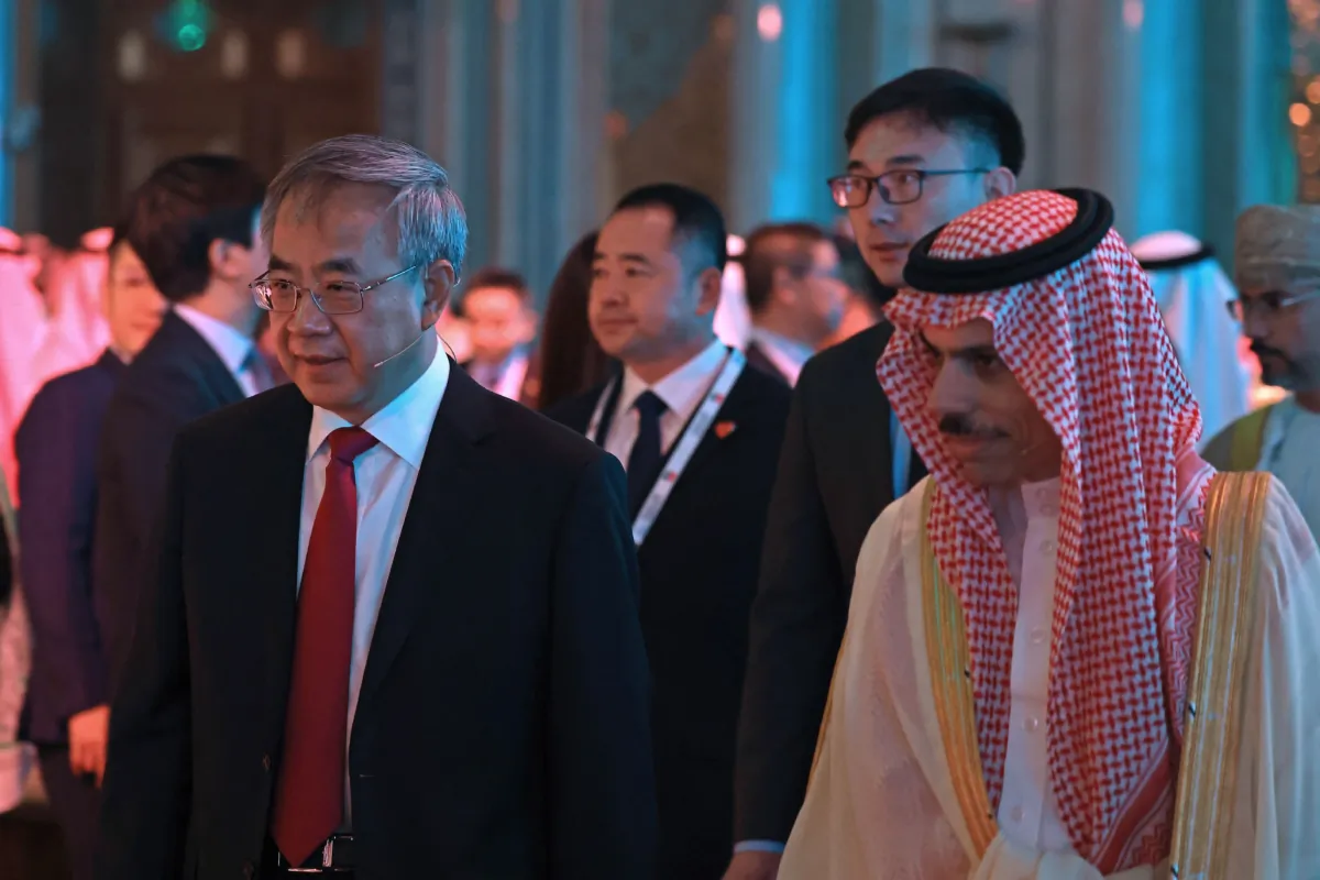 Saudi Foreign Minister Faisal bin Farhan al-Saud (R) and Vice Chairman of the Chinese People's Political Consultative Conference (CPPCC) Hu Chunhua attend 10th Arab-China Business Conference in Riyadh, on June 11, 2023. (Fayez Nureldine /AFP via Getty Images)
