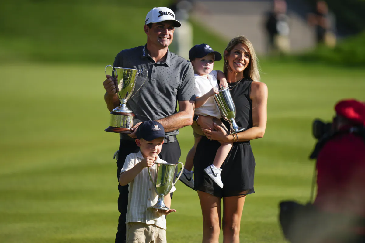 Keegan Bradley celebrates winning the Travelers Championship golf tournament with his family at TPC River Highlands, in Cromwell, Conn., on June 25, 2023. (Frank Franklin II/AP Photo)
