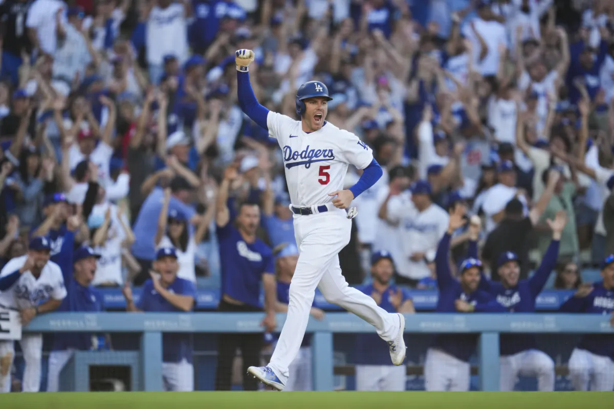 Los Angeles Dodgers' Freddie Freeman (5) celebrates after Will Smith (16) hit a home run during the eighth inning of a baseball game against the Houston Astros in Los Angeles, on June 25, 2023. (Ashley Landis/AP Photo)