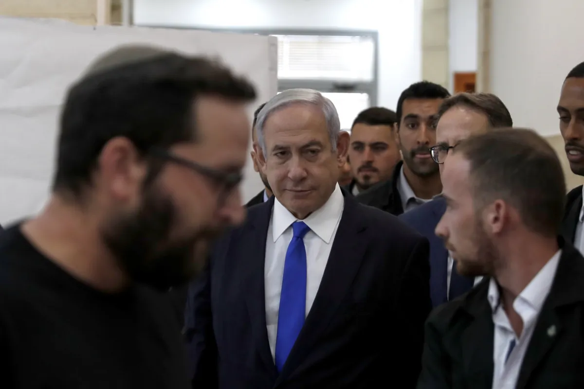 Israeli Prime Minister Benjamin Netanyahu (C) arrives at the District Court in Jerusalem, Israel, on June 25, 2023. (Atef Safadi/Pool Photo via AP)