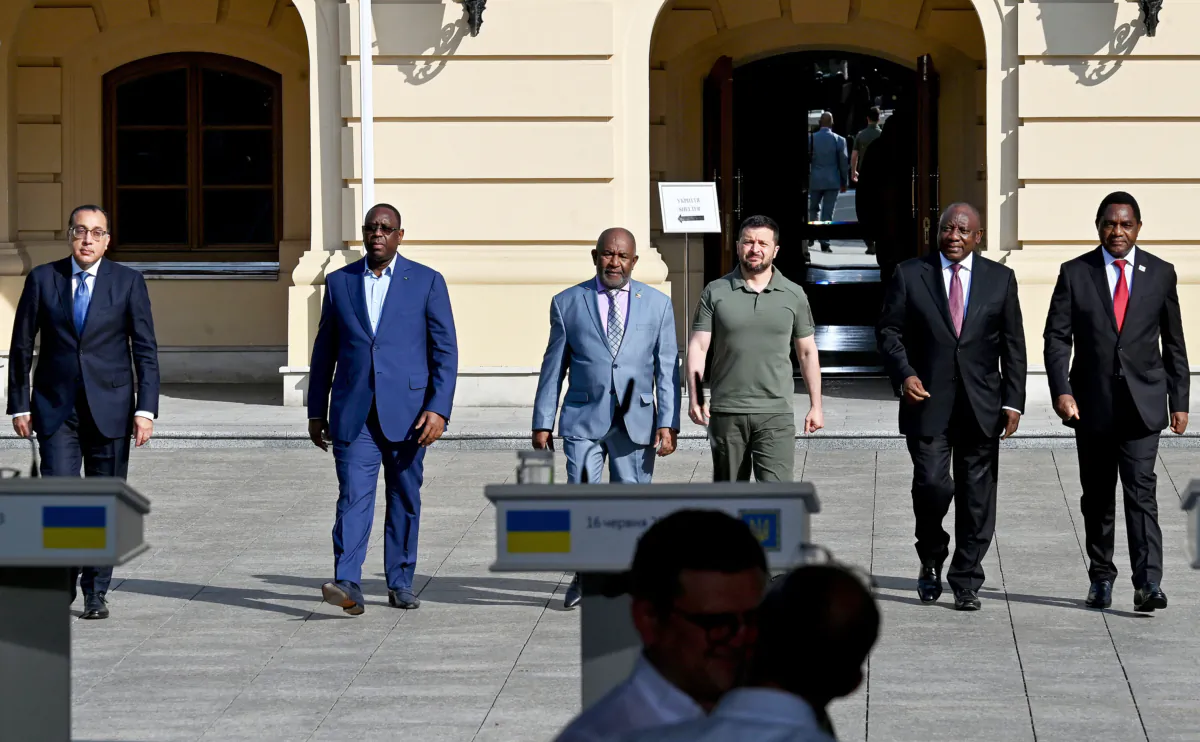 Egypt's Prime Minister Mostafa Madbouly (L), Senegal's President Macky Sall (2L), Comoros President Azali Assoumani (3L), Ukraine's President Volodymyr Zelenskyy (3R), South Africa's President Cyril Ramaphosa (2R) and Zambia's President Hakainde Hichilema (R) walk to address media after their talks in Kyiv on June 16, 2023. (Sergei Sup[insky/AFP via Getty Images)