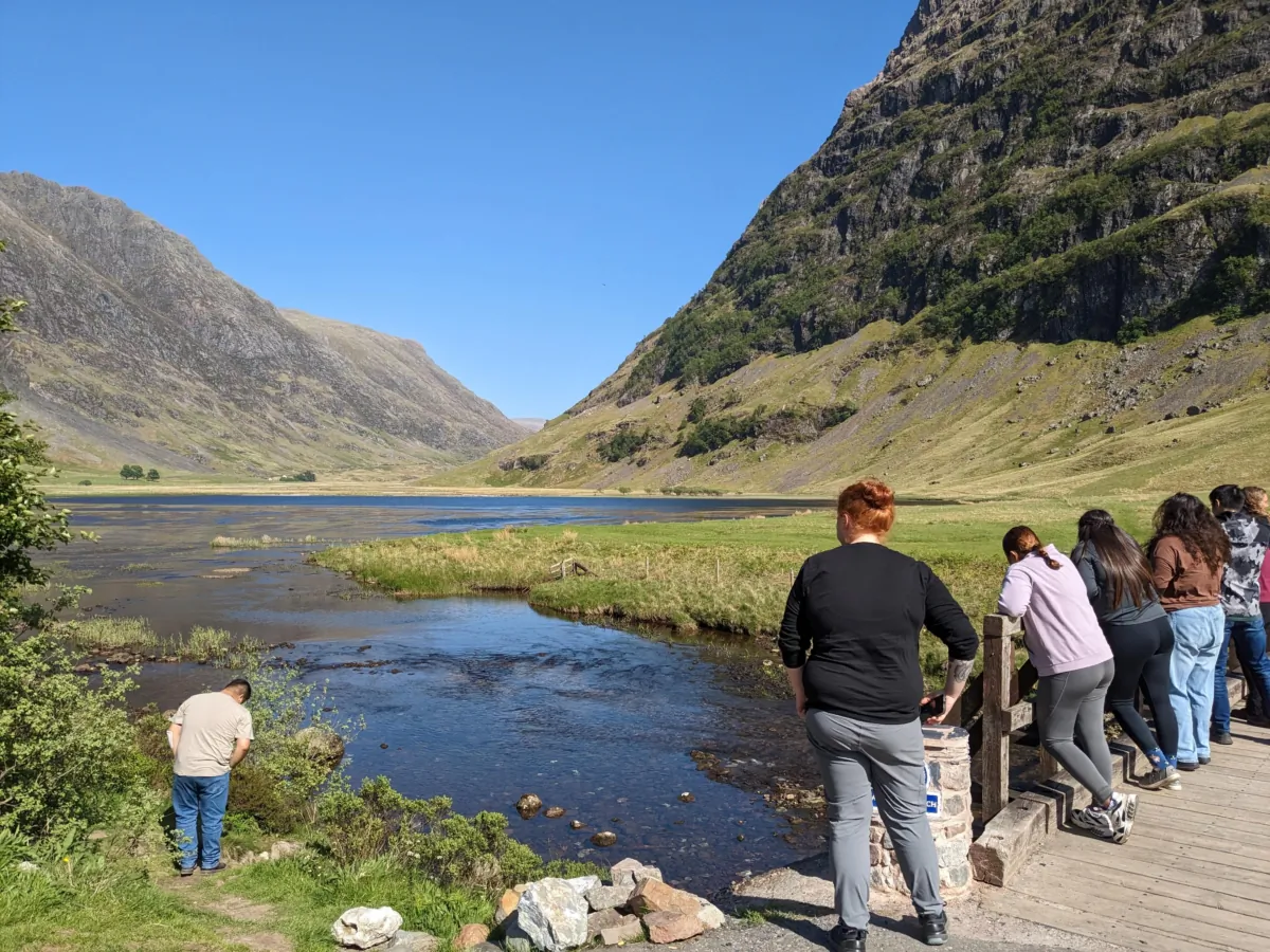 Colleen Kujawa's tour group takes in the landscape at Loch Achtriochtan during a stop in the Scottish Highlands in late May 2023. (Colleen Kujawa/Chicago Tribune/TNS)