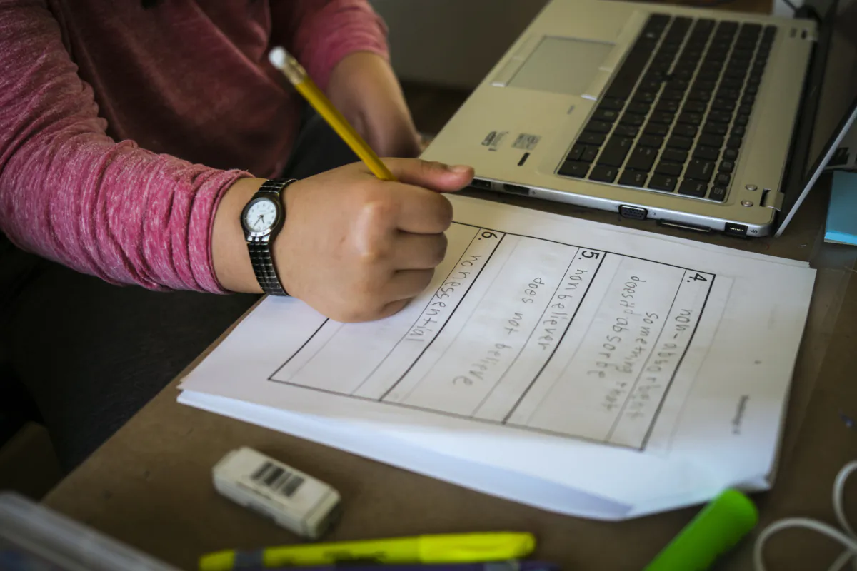 A child writes in their school notebook during a home schooling session in Cremona, Alta., Monday, March 23, 2020, amid the worldwide COVID-19 pandemic. Thousands of students in Calgary will shift to online learning as of today in a bid to curb rising COVID-19 infection rates in the city. THE CANADIAN PRESS/Jeff McIntosh