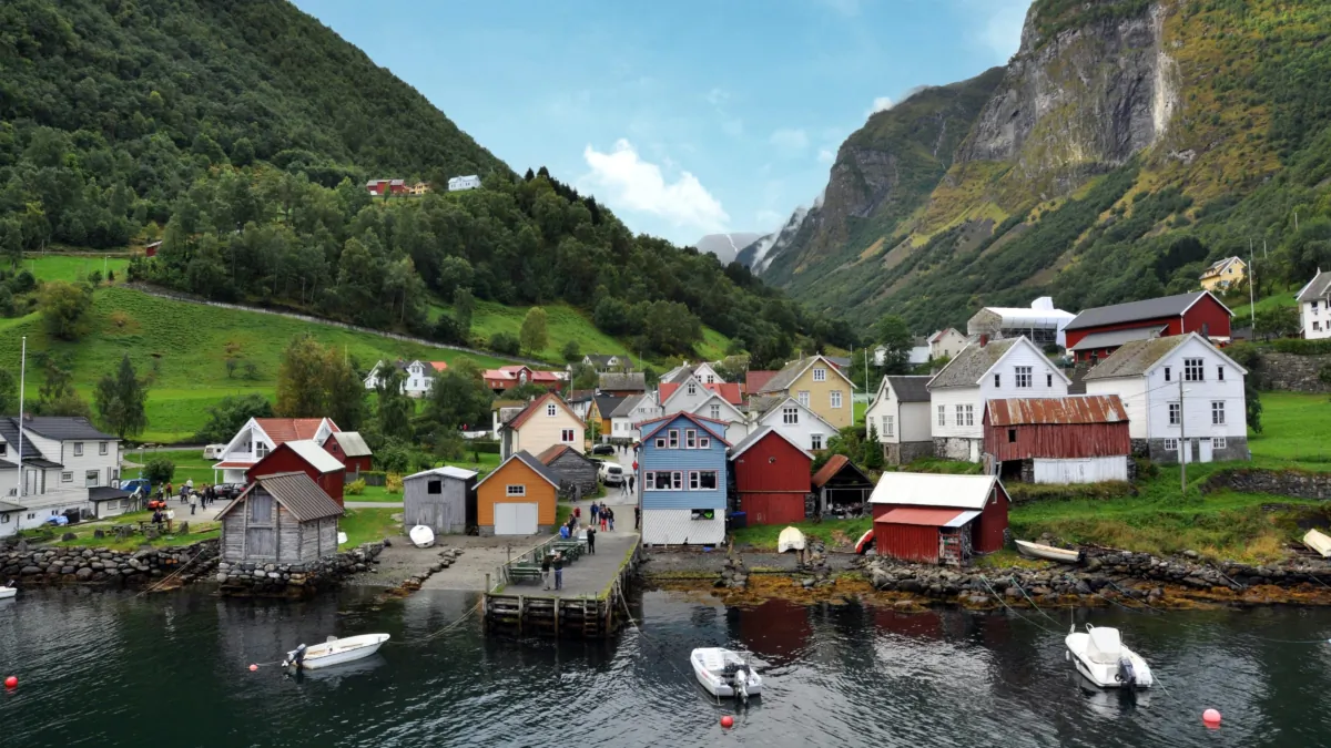 In Norway’s magnificent Sognefjord region, idyllic villages come with a mountainous backdrop. One such village, Undredal, lies along the “Norway in a Nutshell” route sampling the area’s highlights.(Cameron Hewitt, Rick Steves' Europe)