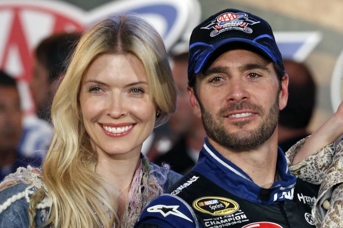 Jimmie Johnson poses with his wife Chandra Janway in victory lane after his win in a NASCAR Sprint Cup Series auto race at Texas Motor Speedway in Fort Worth, Texas, on Nov. 4, 2012. (Tim Sharp/AP Photo)
