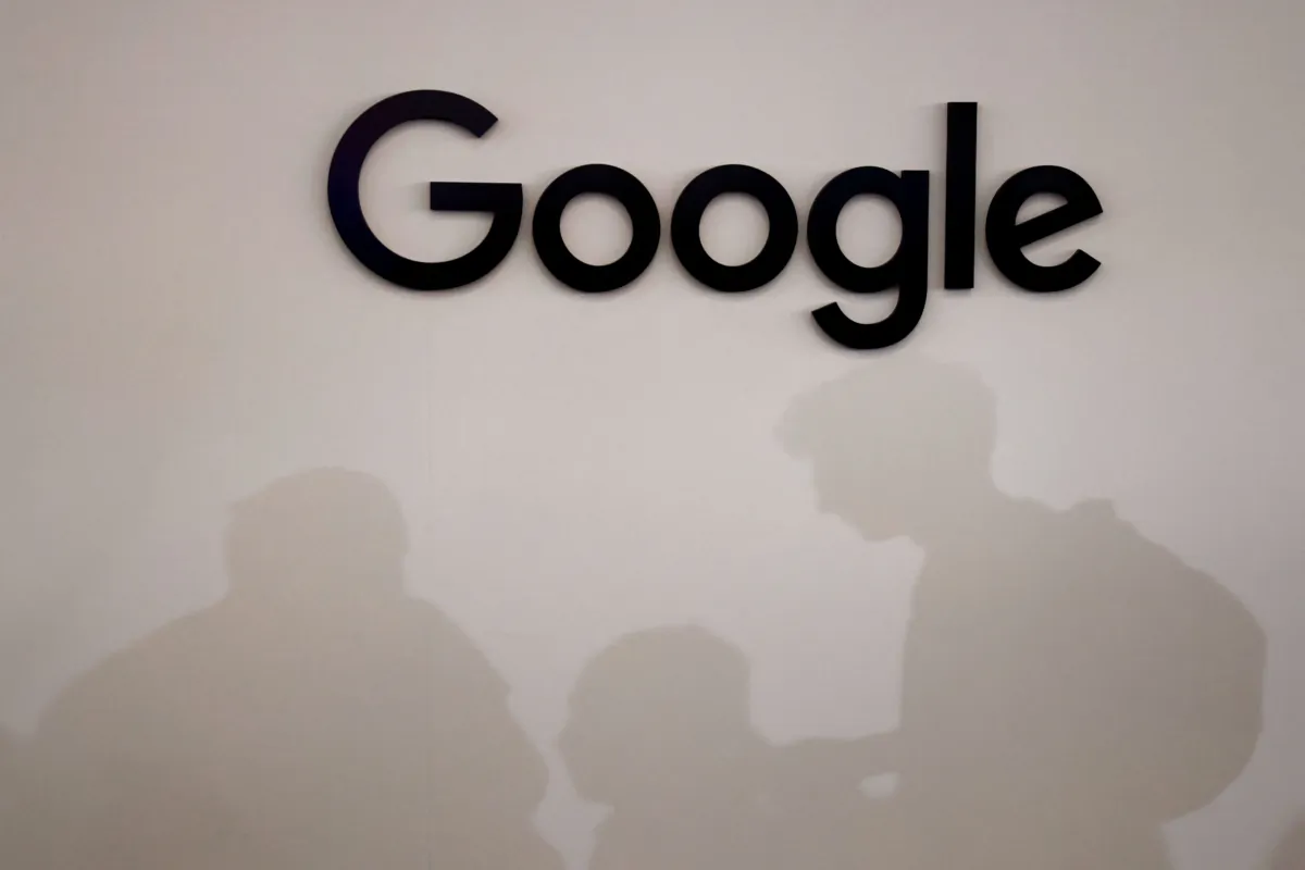 The visitors’ shadows next to the American multinational technology company Google's logo during the Vivatech technology startups and innovation fair in Paris on June 15, 2023. (Ludovic Marin/AFP via Getty Images)