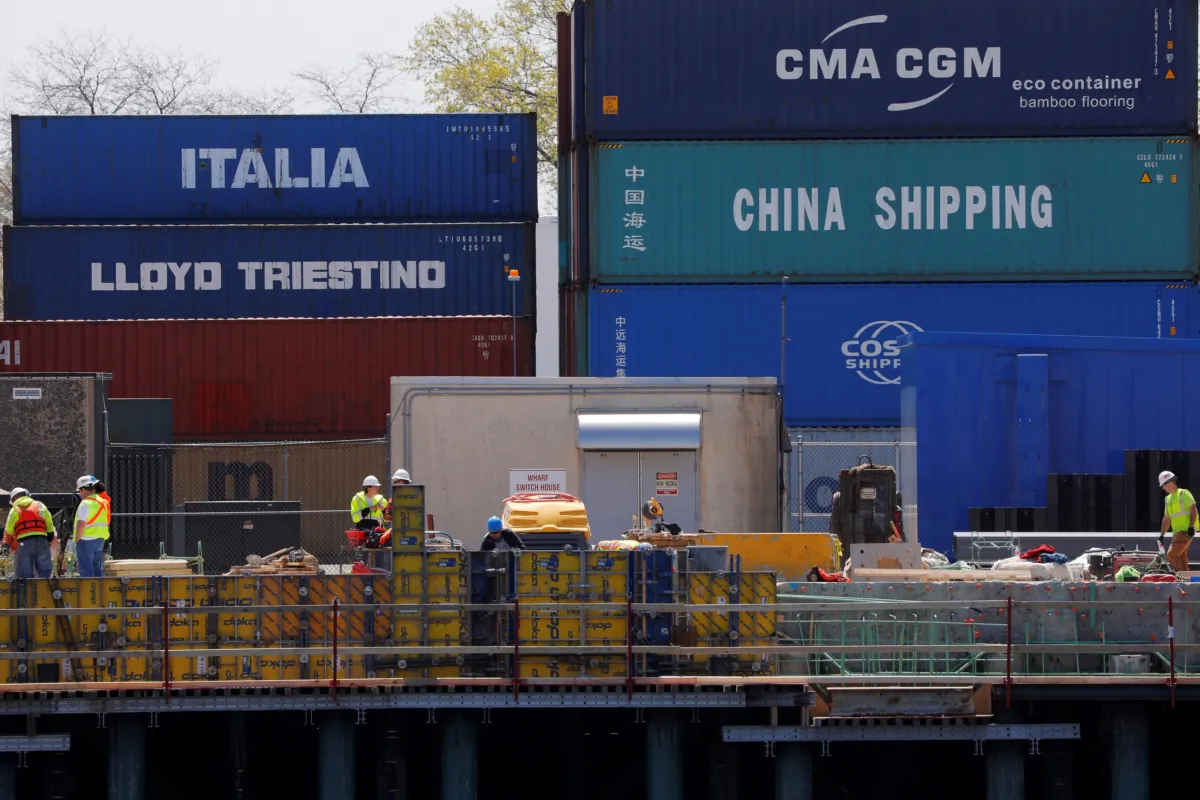 Shipping containers, including one labelled "China Shipping" and another "Italia," are stacked at the Paul W. Conley Container Terminal in Boston on May 9, 2018. (Brian Snyder/Reuters)