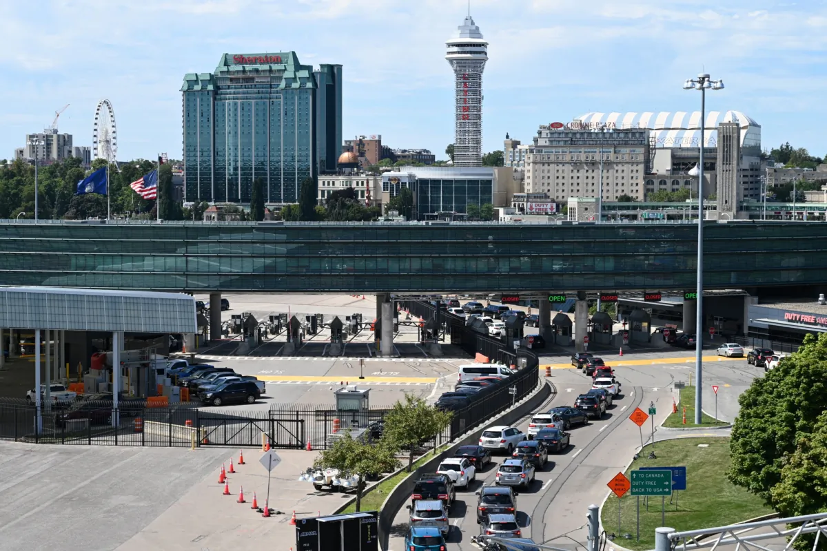 Cars wait in line to go through US customs at the Rainbow Bridge between Niagara Falls, New York and cross the border to Niagara Falls, Ontario, Canada on August 13, 2022.  (Daniel Slim/AFP via Getty Images)