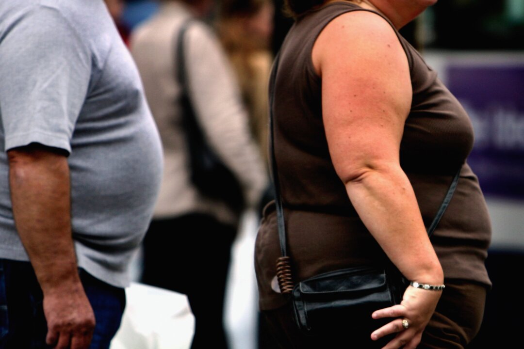 An overweight person walks through Glasgow city centre in Glasgow, Scotland on Oct. 10, 2006. (Jeff J Mitchell/Getty Images)