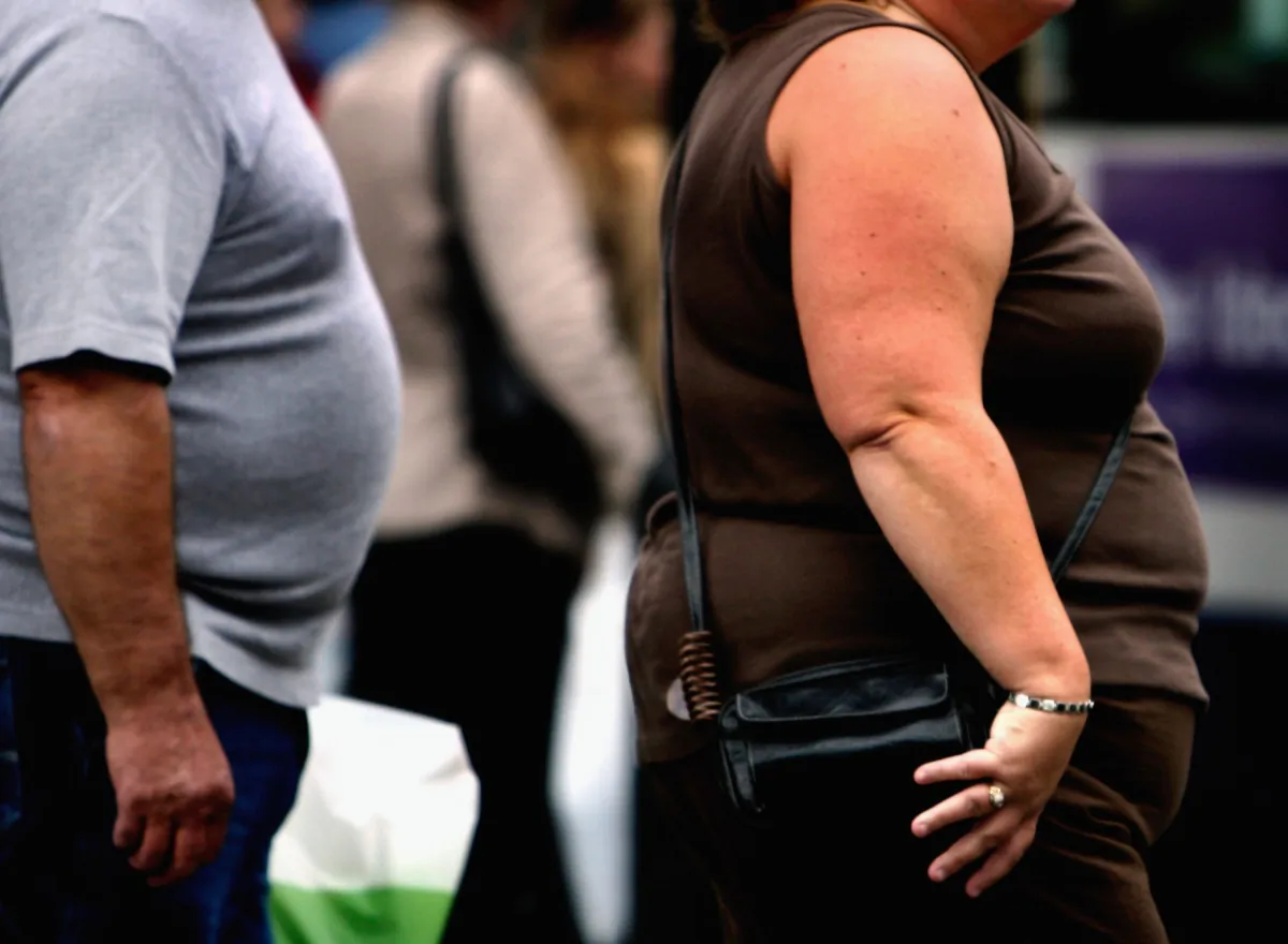 An overweight person walks through Glasgow city centre in Glasgow, Scotland, on Oct. 10, 2006. (Jeff J. Mitchell/Getty Images)