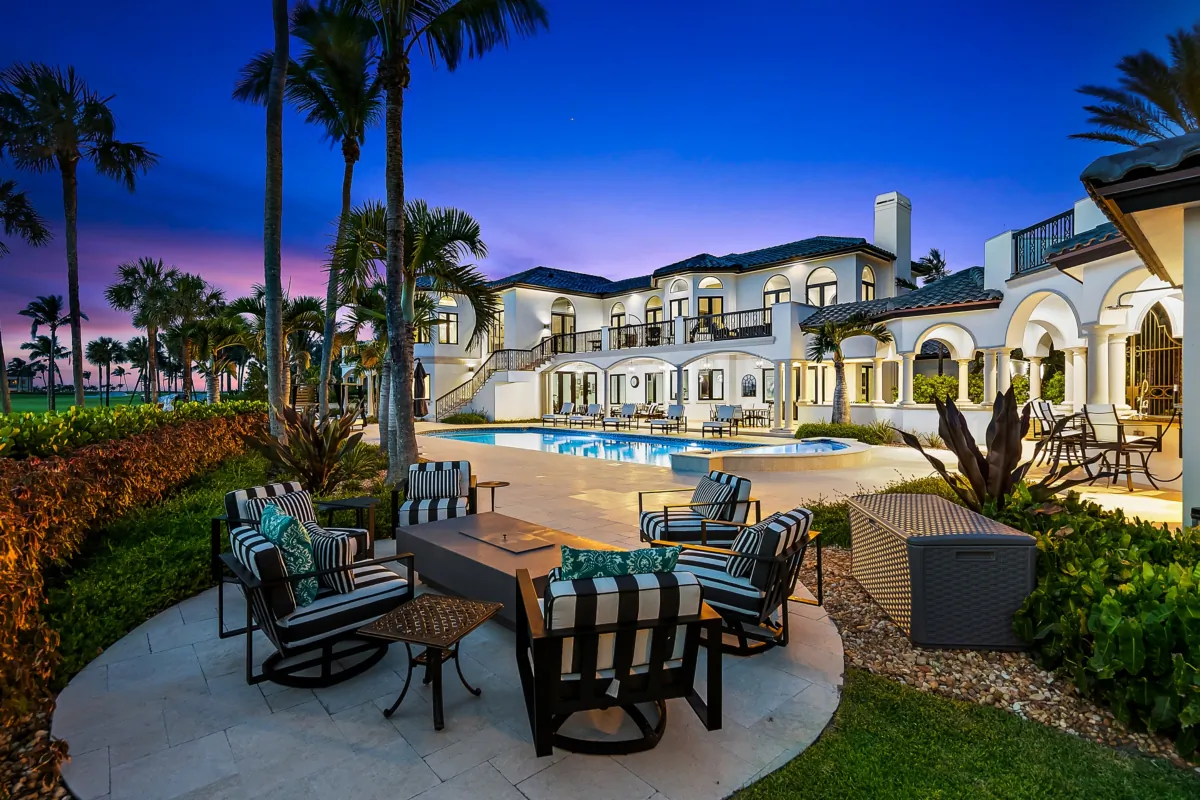 With the pool and home providing a beautiful backdrop, the lounging area with a fire pit is an ideal place to spend relaxing evenings. (Courtesy of Andy Frame and Adam Dooms)
