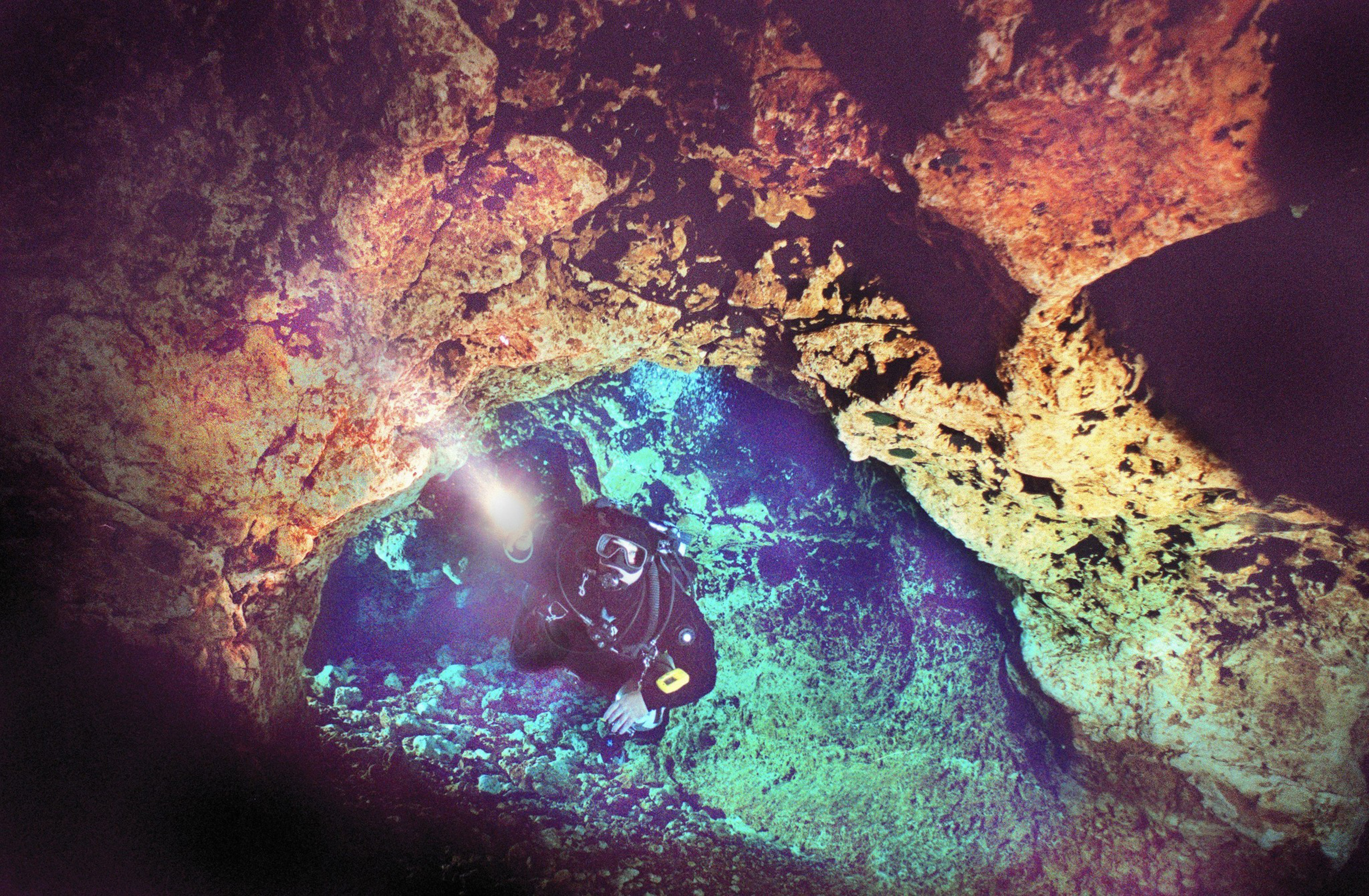 Floating through the invisible water of the aquifer, Josh Dolan, cave diving instructor at Ginnie Springs north of Gainesville, travels through the Devil’s Eye into the Devil’s Ear underwater cave system that goes under the Santa Fe River.