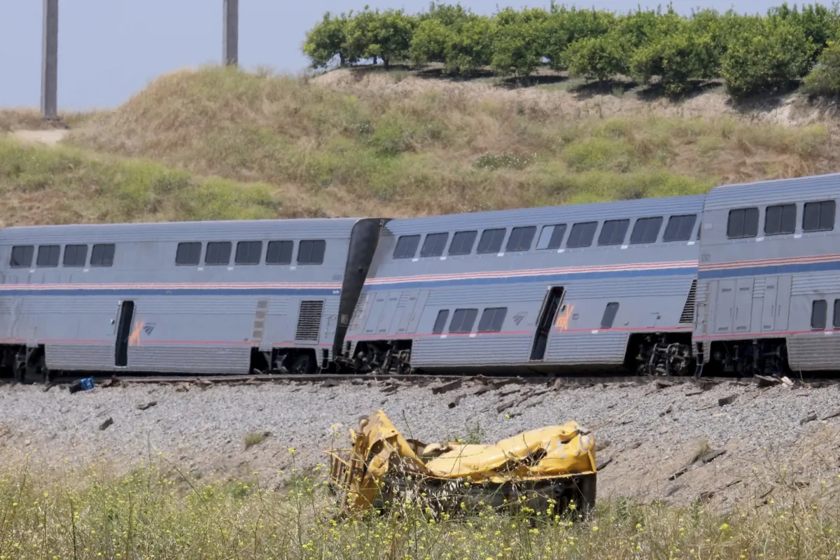 A destroyed truck lies near a derailed Amtrak train in Moorpark, Calif., on June 28, 2023. (Dean Musgrove/The Orange County Register via AP)