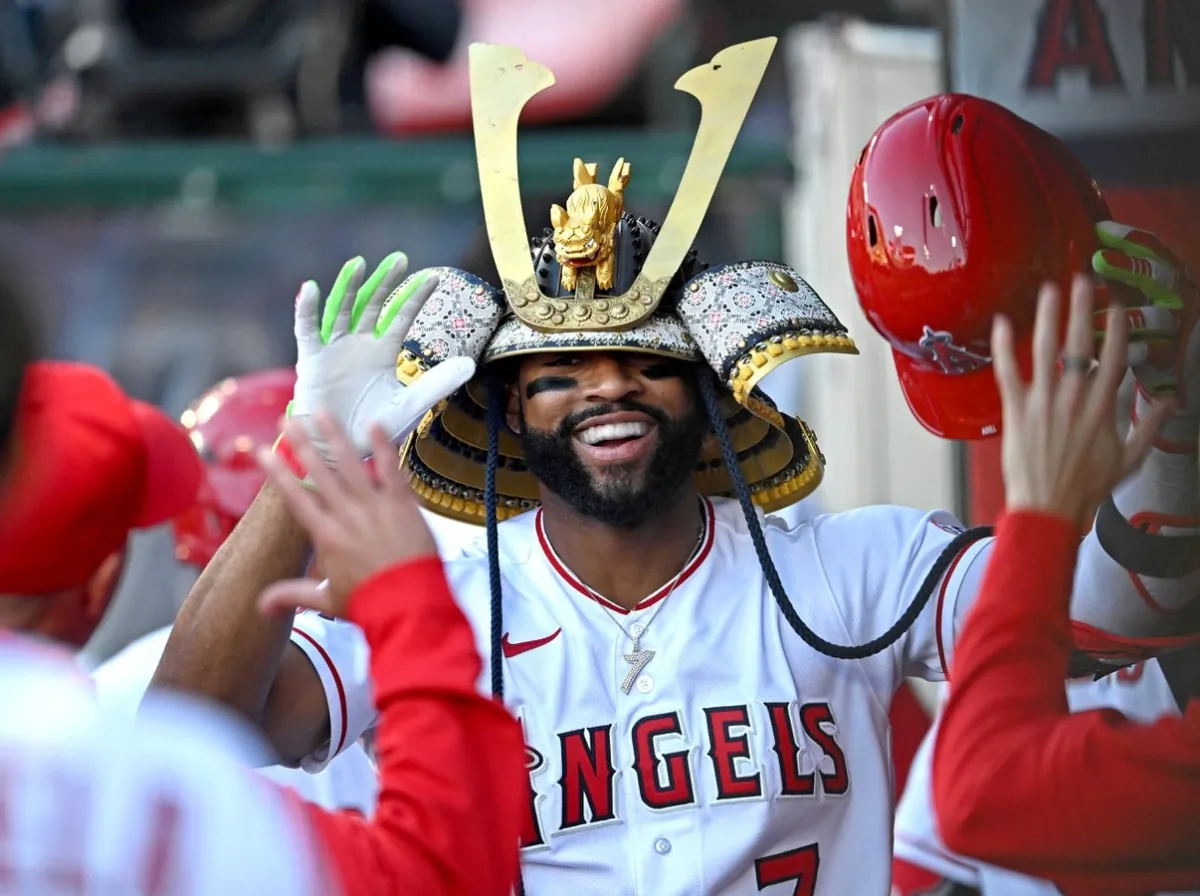 Los Angeles Angels right fielder Jo Adell (7) is congratulated in the dugout after hitting a solo home run in the second inning against the Chicago Cubs at Angel Stadium in Anaheim, Calif., on Jun 8, 202. (Jayne Kamin-Oncea/USA TODAY Sports via Field Level Media)