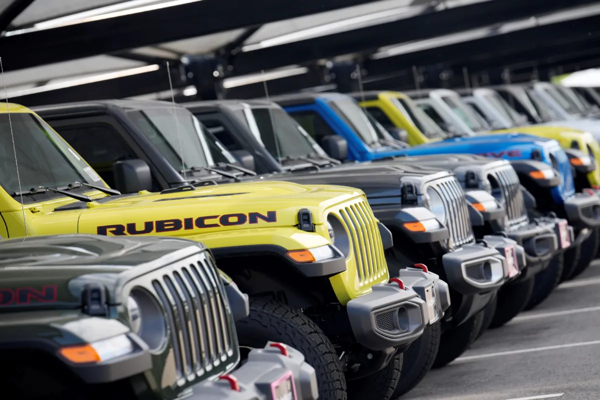 Unsold 2023 Gladiator pickup trucks sit in a long row at a Jeep dealership in Englewood, Colo., on June 18, 2023. (David Zalubowski/AP Photo)