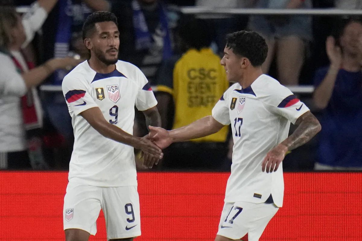 United States' Jesus Ferreira (9) is congratulated by teammate Alejandro Zendejas (17) after scoring during the first half of a CONCACAF Gold Cup soccer match against St. Kitts & Nevis in St. Louis on June 28, 2023. (Jeff Roberson/AP Photo)