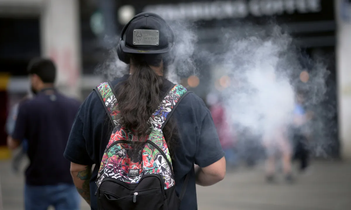 A man smokes a vape device in Manchester, England, on May 30, 2023. (Christopher Furlong/Getty Images)