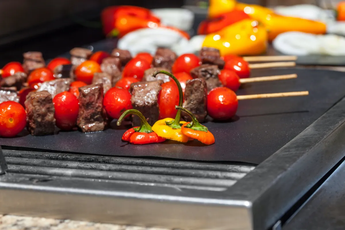 Grill mats can be used between your food and the grill and then simply run through the dishwasher. (Jessica M. Sarnese/Shutterstock)
