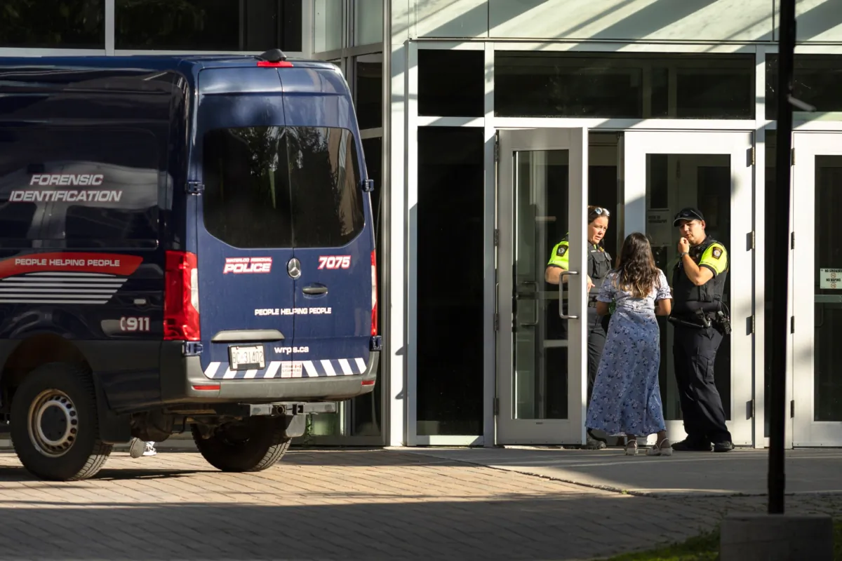 Members of the Waterloo Regional Police investigate a stabbing at the University of Waterloo, in Waterloo, Ont., Wednesday, June 28, 2023. Waterloo Regional Police said three victims were stabbed inside the university’s Hagey Hall, with one person was taken into custody. (Nick Iwanyshyn/The Canadian Press)