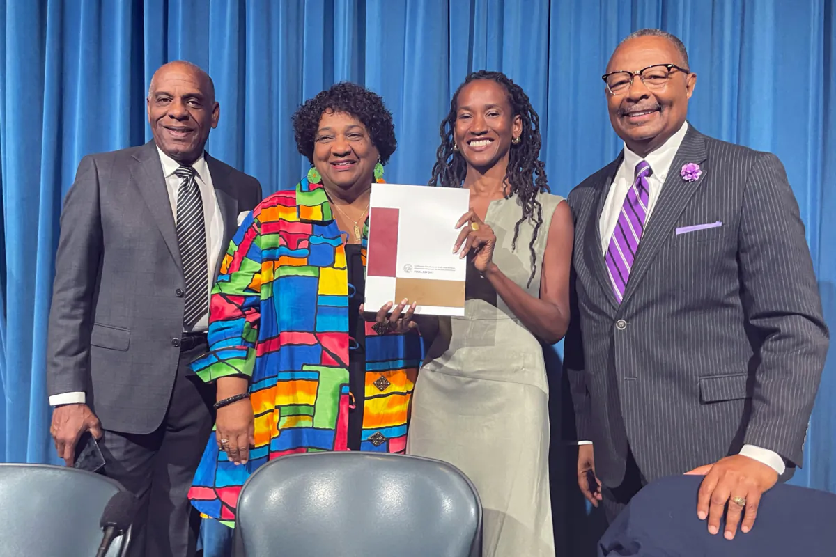 (L-R) State Sen. Steven Bradford, Secretary of State Shirley Weber, task force member Lisa Holder, and Assemblyman Reggie Jones-Sawyer hold up a final report of the California Task Force to Study and Develop Reparation Proposals for African Americans during a hearing in Sacramento, Calif., on June 29, 2023. (Haven Daley/AP Photo)