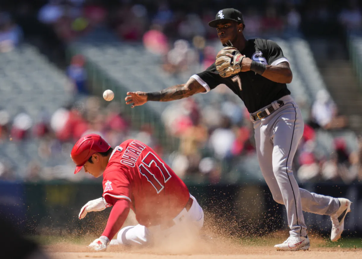 Chicago White Sox shortstop Tim Anderson (7) throws to first over Los Angeles Angels designated hitter Shohei Ohtani (17) during the seventh inning of a baseball game in Anaheim, Calif., on June 29, 2023. (Ashley Landis/AP Photo)