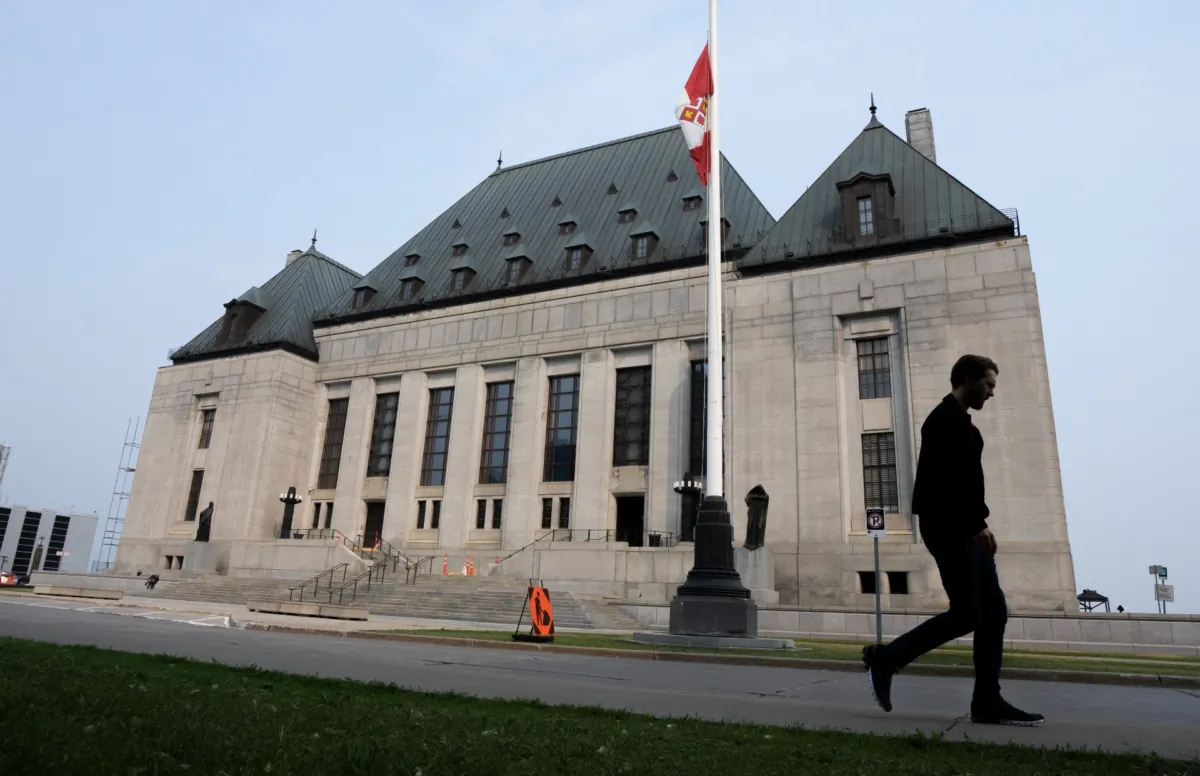 A man walks past the Supreme Court of Canada in Ottawa on June 16, 2023. (The Canadian Press/Adrian Wyld)
