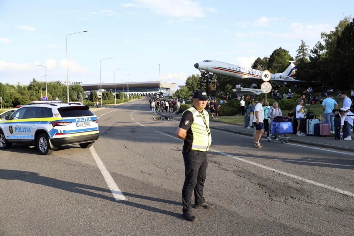 Passengers are evacuated from Chisinau airport in Moldova on June 30, 2023, after a shooting with two victims. (Cristian Straista/AP Photo)