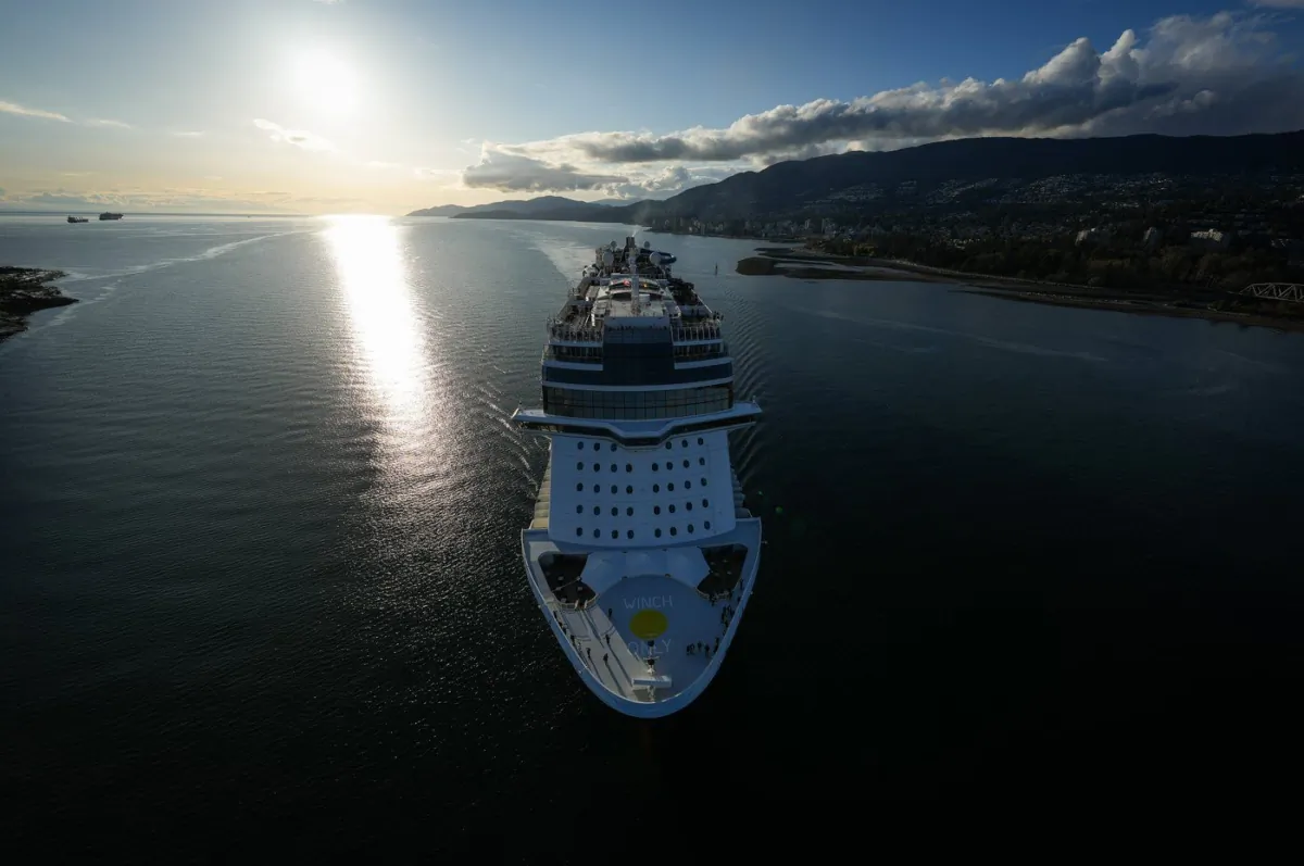 The Norwegian Cruise Line ship Norwegian Bliss passes under the Lions Gate Bridge upon arrival in Vancouver, on April 13, 2023. (The Canadian Press/Darryl Dyck)