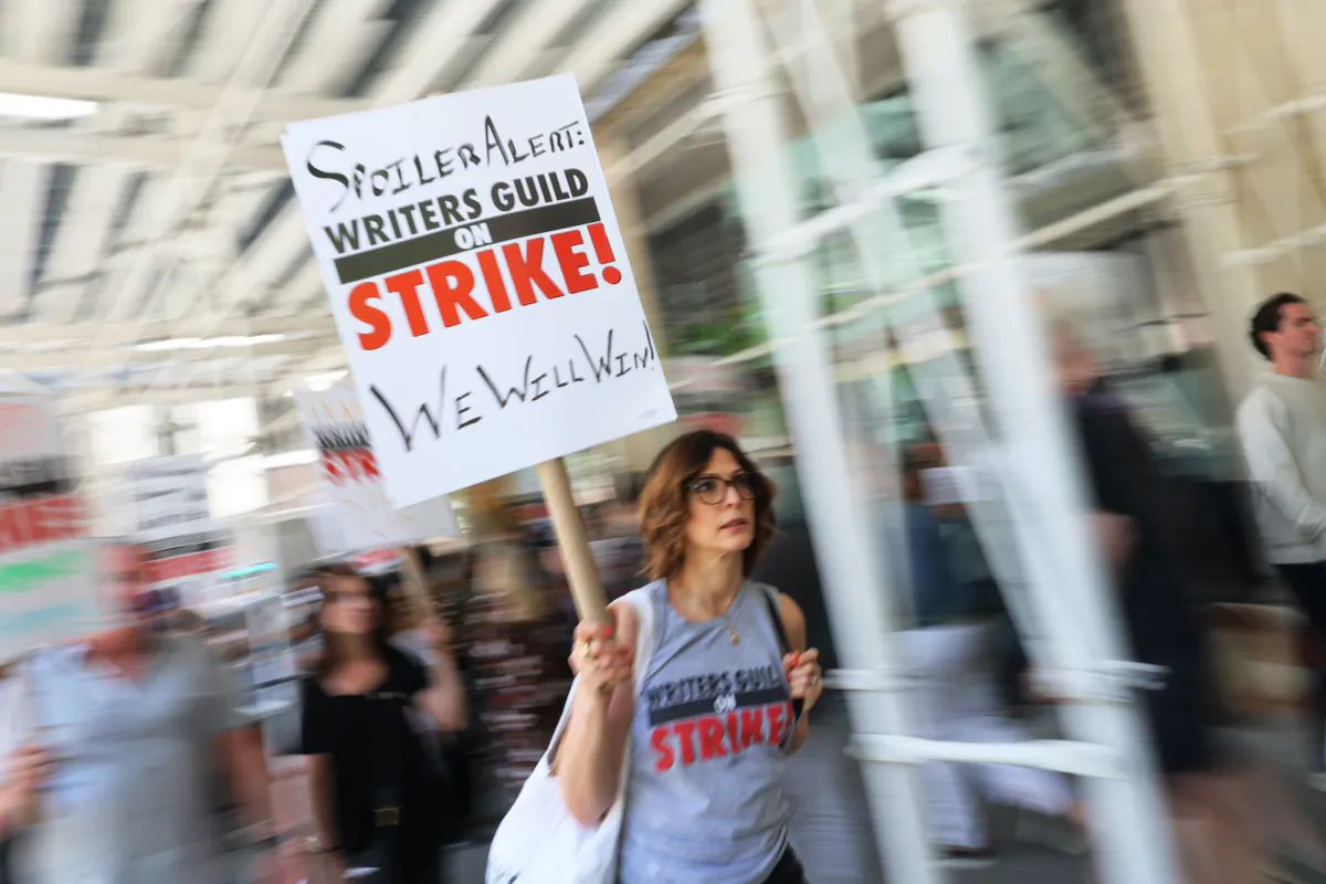 Writers Guild of America (WGA) East members join United Musicians and Allied Workers (UMAW) as they picket at the Penske Media Corporation's offices in New York City on May 31, 2023. (Michael M. Santiago/Getty Images)